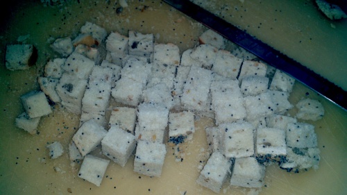 Cut the slices into sugar cube sized pieces,  if you want your croutons to be more elegant remove the crust